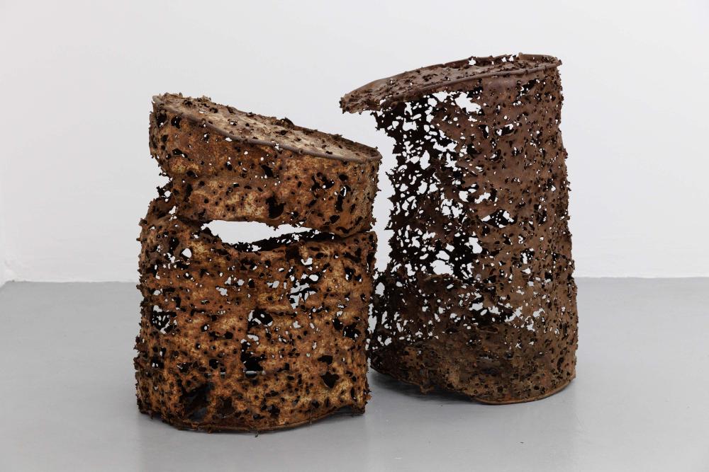 If everything that exists has a place, place too will have a place, 2020 Bullet-riddled boundary barrels,  87 × 58 cm diameter Courtesy private collection Photo: Bernd Euring